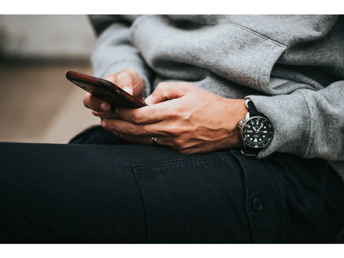 Client using phone to search for professionals